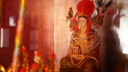 Buddhist traditional statues of chinese sacred gods on the altar inside the temple Stock Footage