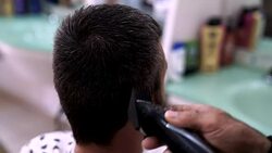 Barber Cuts the Hair in the Barbershop. Stock Footage