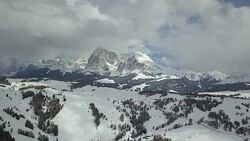 Flying on Seiser Alm with Langkofel mountain in background Stock Footage