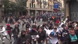 CLEAN : Barcelona protests: demonstrators run from police outside National Police HQ News Clip