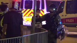 Riot policeman points pepper spray at media News Clip