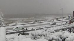Stomy sea and beach covered in snow News Clip