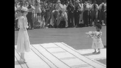 Fiji Islanders dance and give a torch light escort to Queen Elizabeth II and the Duke of Edinburgh on their visit to the islands News Clip