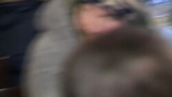 Drinkers at pavement tables outside pub News Clip