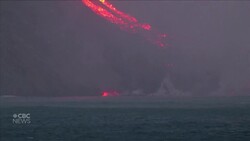 Lava from Canary Islands volcano streams on as night falls News Clip