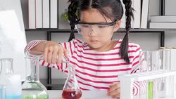 Education Topics:Funny little girl doing experiments in the laboratory.Science and education. Stock Footage