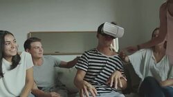 Group of friends playing together: virtual reality VR glasses Stock Footage