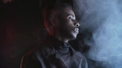 Stylish Man Posing in Studio Filled with Fog Stock Footage