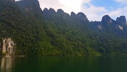 view of landscape limestone mountain rang and green forest with water lake Stock Footage
