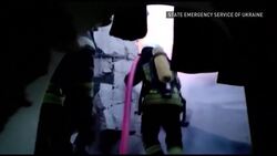 Kyiv resident cries over mother's body under blood-soaked sheet News Clip