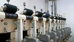 Lots of yarn spools  in textile factory Stock Footage