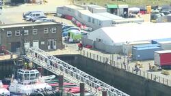 Rescued migrants being taken ashore in Dover News Clip