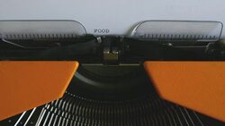 Close up footage of a person writing FOOD CRISIS on an old typewriter Stock Footage