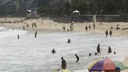CLEAN : Beach goers soak in the sun at Ipanema despite coronavirus concerns News Clip