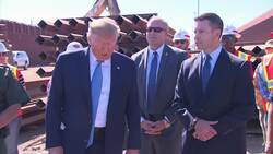 Trump signs name on Mexico border wall News Clip