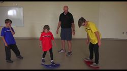 Awesome Phys Ed Activities for Balance (Ep. 19 - Spooner Boards) Instructional Video