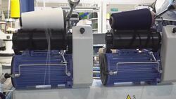 Production of knitwear, Winding machine for the dissolution of defective knitwear Stock Footage