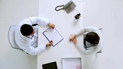 doctor giving diet plan to patient at hospital Stock Footage