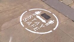 Stay safe sign on pavement News Clip