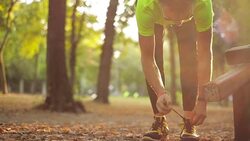 Man exercising / stretching in the park - nature. Stock Footage