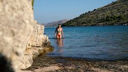Sexy woman going out of the water Stock Footage