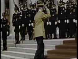 Hitler at an event, with SS officers including Himmler in uniform. Colour footage. Stock Footage