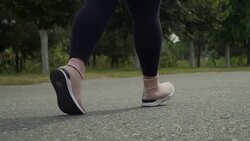 Legs run along the road Stock Footage