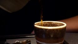 focus on pouring sake in the cup. Japanese tradition Stock Footage