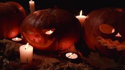 large and small pumpkins with carved faces. Halloween. Stock Footage