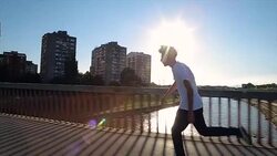 Skateboarder riding skateboard through the streets Stock Footage
