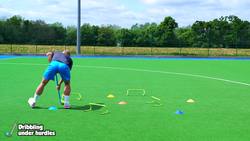 Striking - (Hockey) Dribbling under hurdles Instructional Video