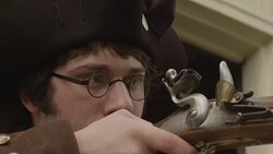 Young Revolutionary war soldier aiming musket Stock Footage