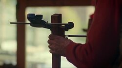 An electric drill pulses as it is used to fix two clamped peices of wood together. Stock Footage