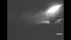 During Korean War, US soldiers in South Korea firing rockets at night at Communist positions News Clip