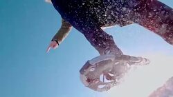 SLO MO Unrecognizable person jumping over the camera with snowshoes Stock Footage