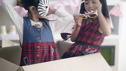 Children playing with cardboard box Stock Footage