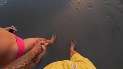 Couple holding hands at Seminyak beach in Bali Stock Footage