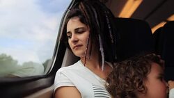 Close-up Portrait of a mother and her little daughter traveling with train Stock Footage