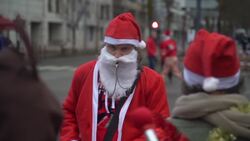 Four thousand runners dressed as Santa race outside Paris Instructional Video