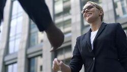 Business woman shaking hand with coworker, interpreter acquainting with client Stock Footage