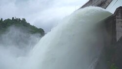 Slow motion of water dam drained from outlet pipe of the dam where is the hydropower electrical generation Stock Footage