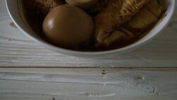 hard-boiled egg in brown sauce or sweet gravy sauce with tofu Stock Footage