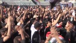 CLEAN : Iraqis in Baghdad rally to revive year-old revolt against the system News Clip