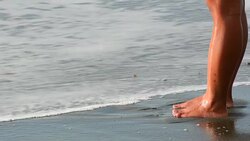 Filipino woman standing on the beach in the Philippines Stock Footage