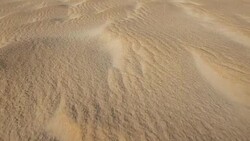 smooth footage of the ripples generated by the wind on the desert sand dunes Stock Footage