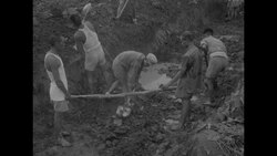 North Koreans working in trench near Peace Pagoda construction site at Panmunjom News Clip
