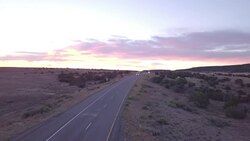 Aerial Drone Footage of Semi-Trucks Rolling Down the Highway Stock Footage