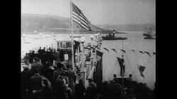 Atlantic Ocean, 1952: After the Flying Enterprise sinks, the ocean turns calm and Carlsen and Dancy are welcomed back at the port Stock Footage