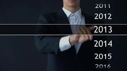 Businessman selects 2017 year in virtual menu, search for data, business history Stock Footage