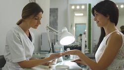 Charming girl in a manicure salon Stock Footage